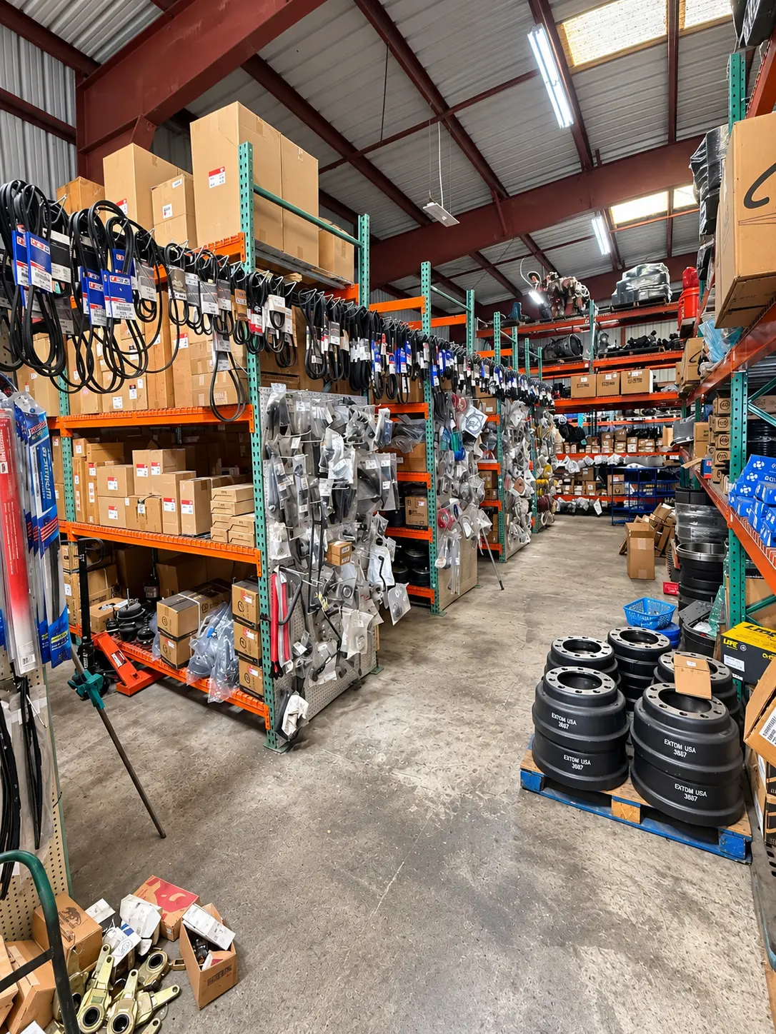 Truck parts stocked on shelves in the shop's parts room